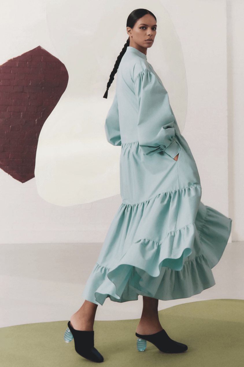 Noëlla Coursaris Musunka models a blue tiered maxu dress from the Malaika and Roksanda collaboration with The Outnet